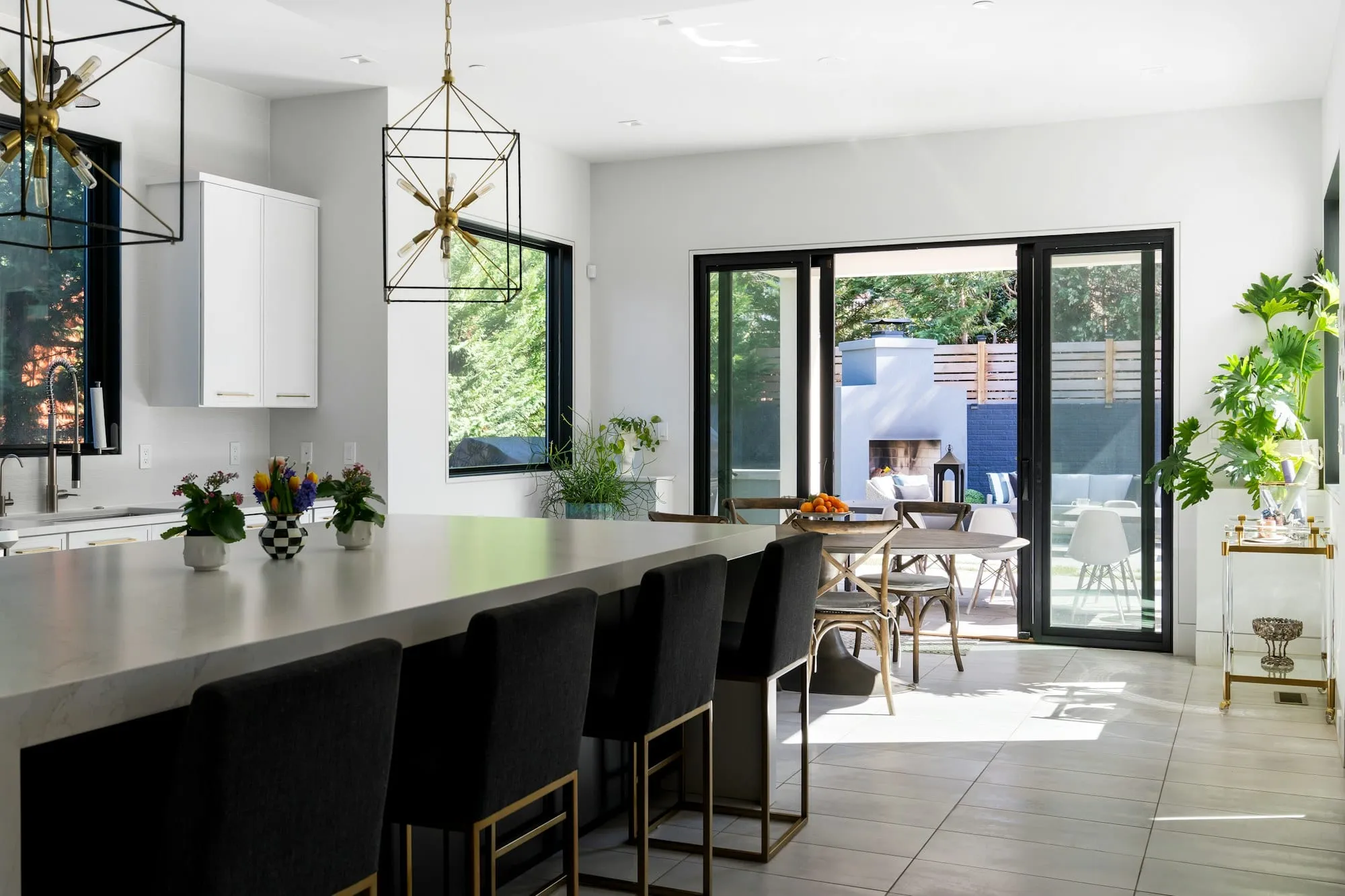Finished open-plan kitchen with island and garden doors