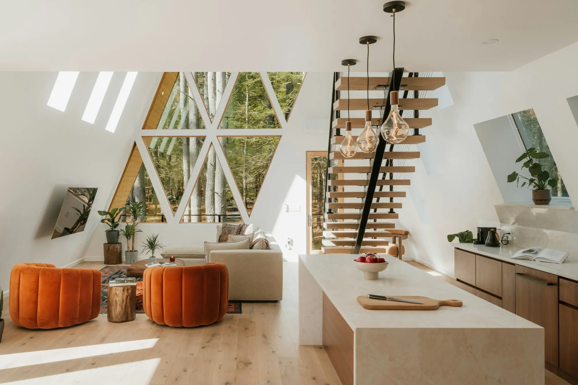 Bright open-plan room with a vaulted A-frame ceiling